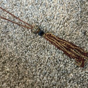 Red maroon chain necklace with gray beads gold and red chain tassel
